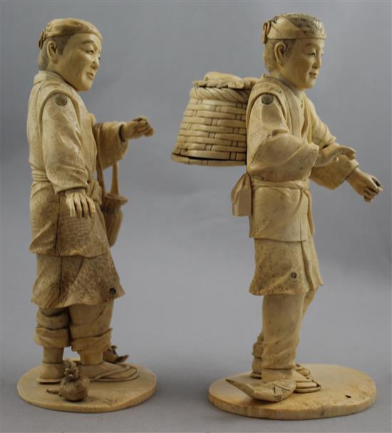 A pair of Japanese bone and ivory sectional figures of fruit pickers, early 20th century, 21cm and 22cm, losses